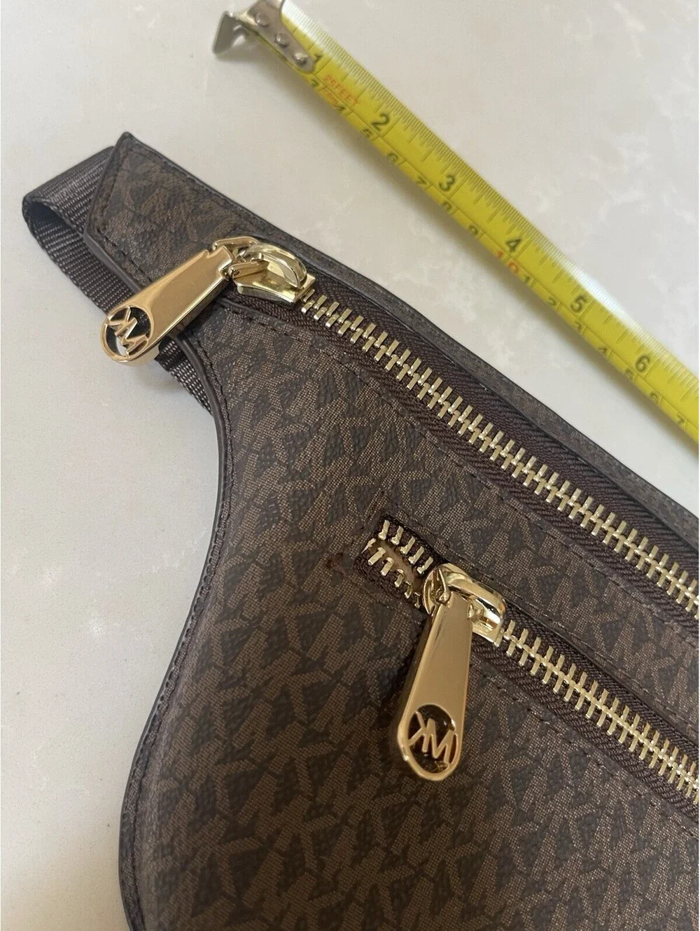 Michael Kors Logo Double-Zip Fanny Pack in brown with gold-tone hardware